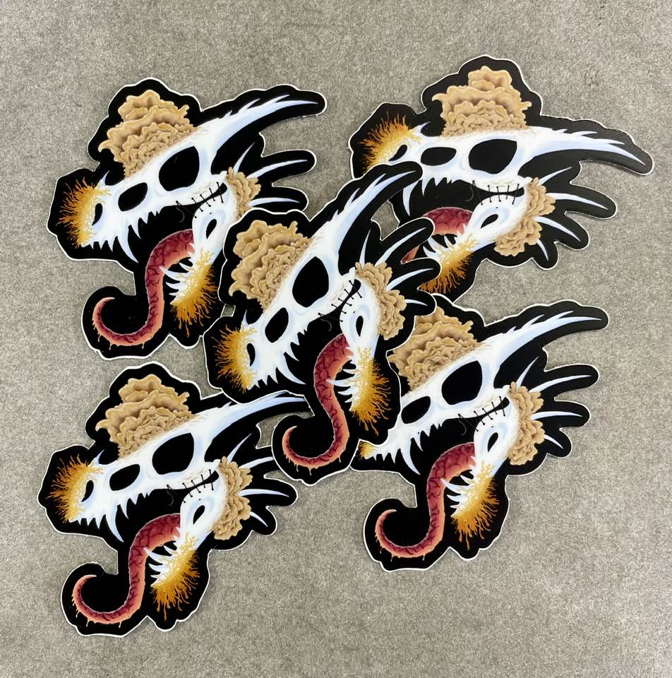 dragon skull with three different types of mushrooms growing from it on matte die cut stickers