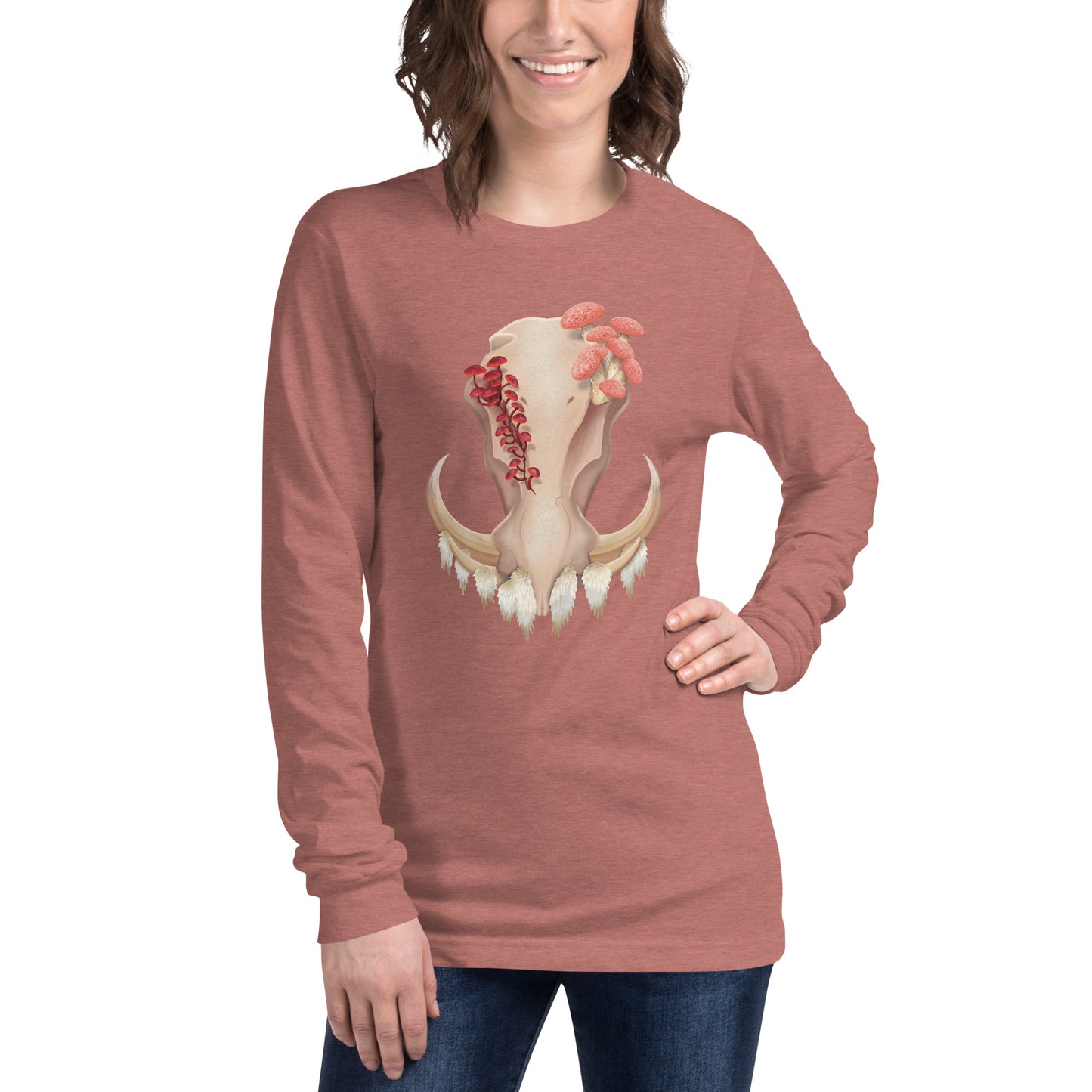 An adult wearing a heather mauve colored, unisex, long sleeve shirt featuring a front facing warthog skull with 3 different kinds of fungi growing out of it