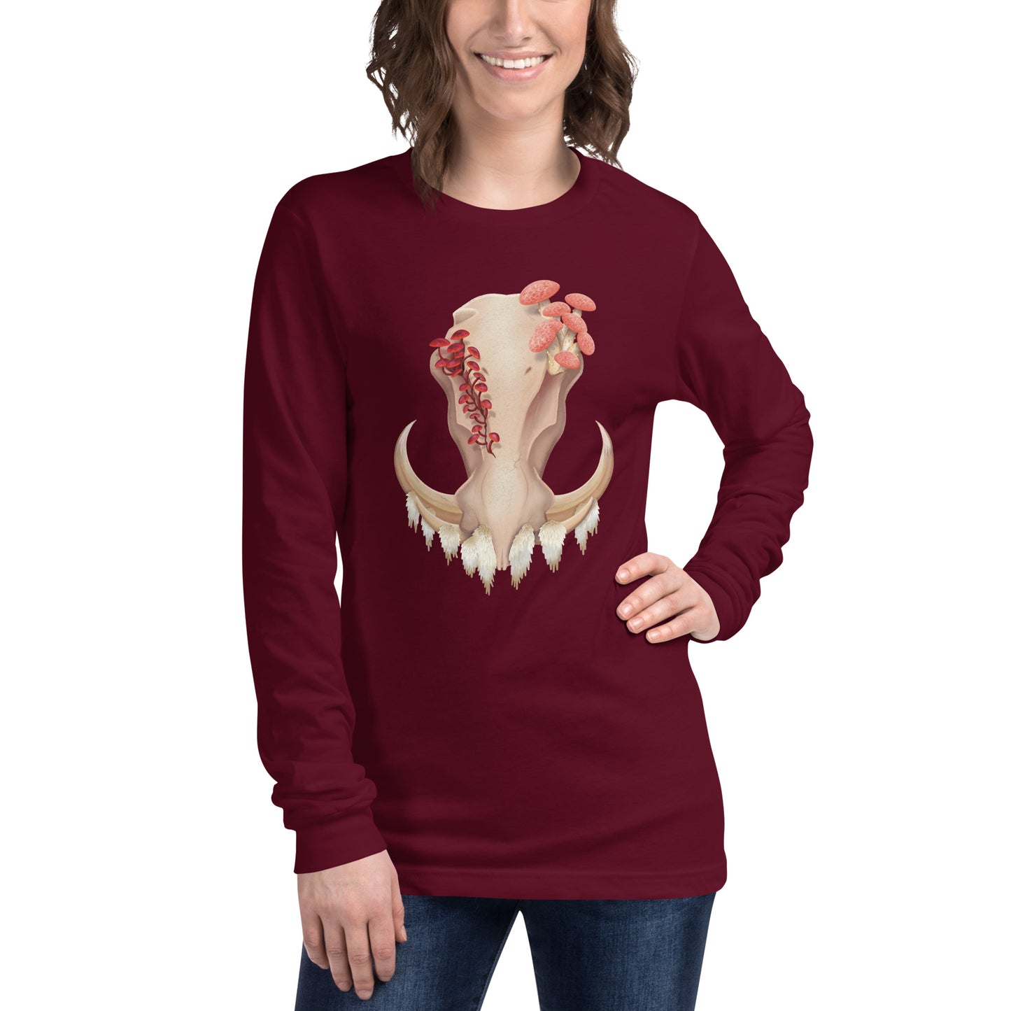 An adult wearing a maroon colored, unisex, long sleeve shirt featuring a front facing warthog skull with 3 different kinds of fungi growing out of it