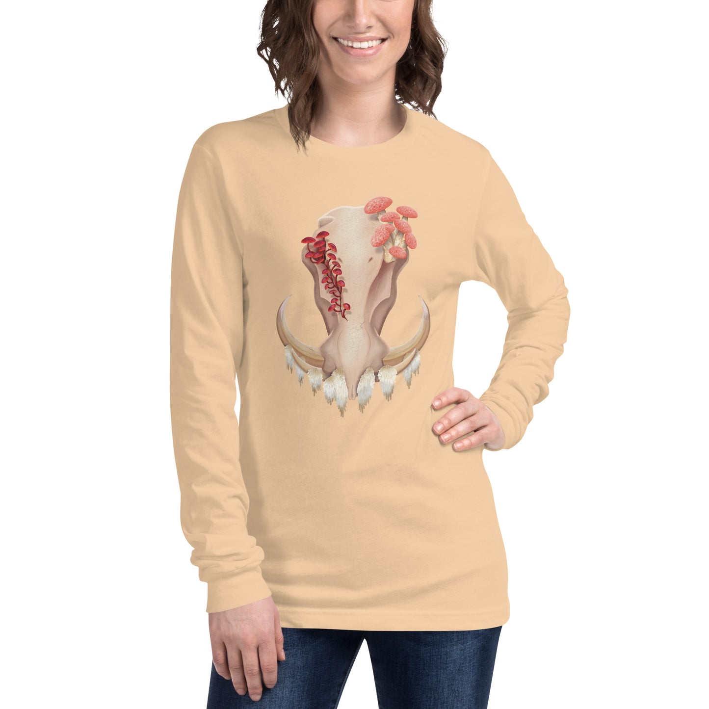 An adult wearing a sand colored, unisex, long sleeve shirt featuring a front facing warthog skull with 3 different kinds of fungi growing out of it