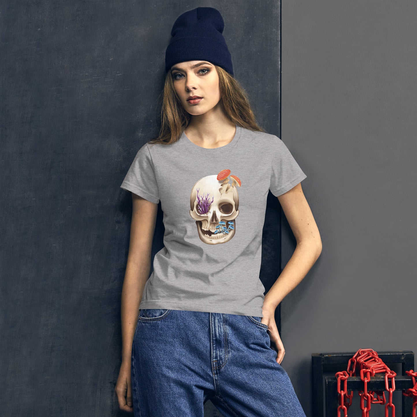 A light heather grey woman's fit t shirt featuring a human skull with various kinds of fungi growing out of it