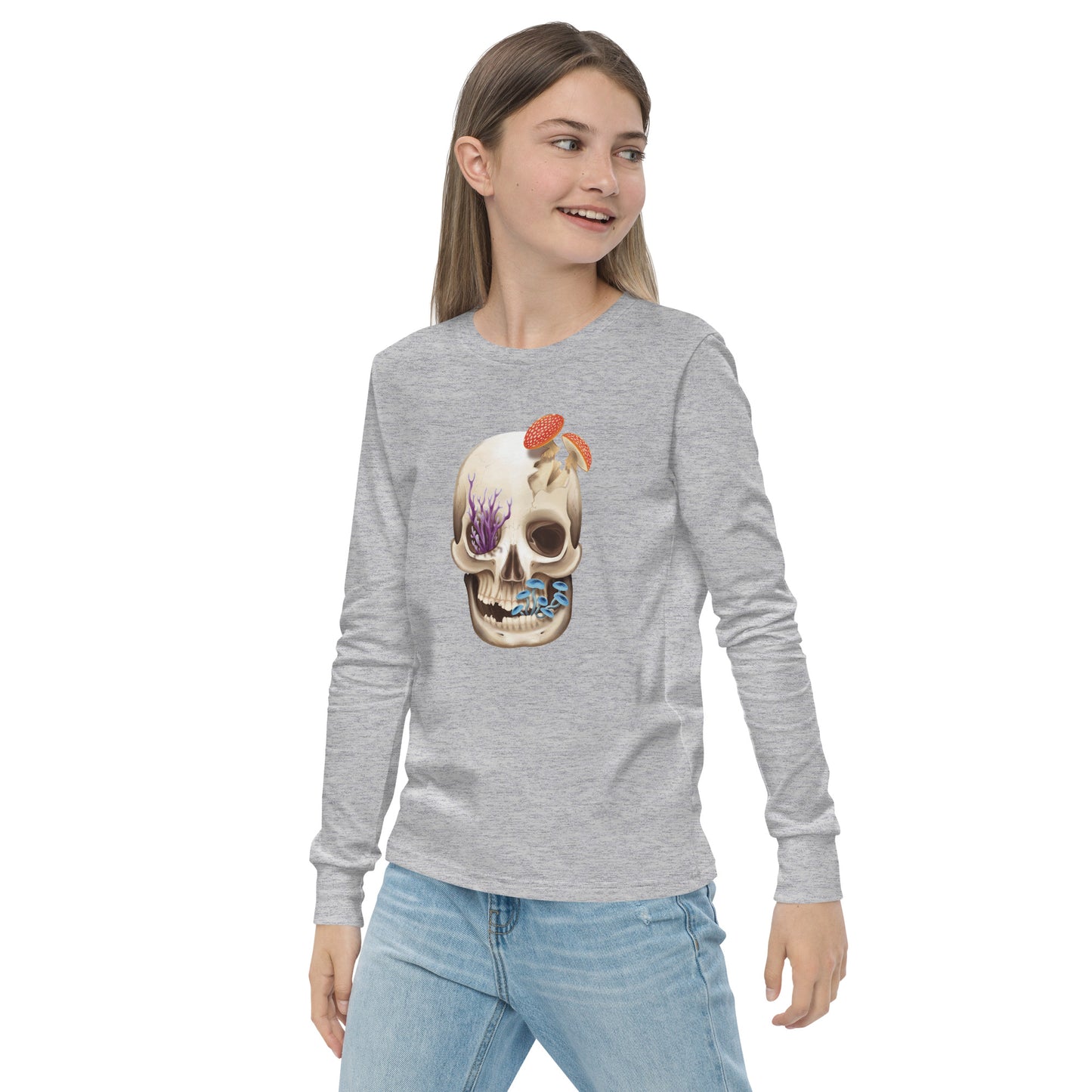 A unisex youth sized, light heather grey in color, long sleeve shirt featuring a human skull with various kinds of fungi growing out of it