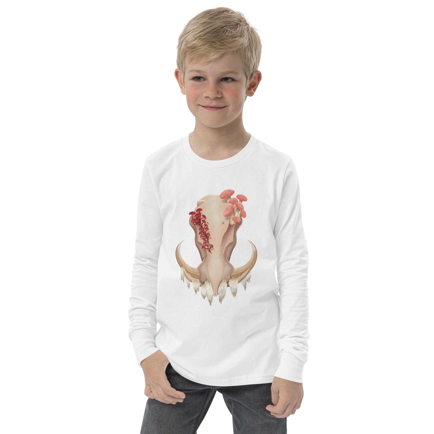 A child wearing a white colored, unisex, long sleeve shirt featuring a front facing warthog skull with 3 different kinds of fungi growing out of it